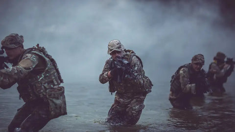 military members advancing through fog and swamp