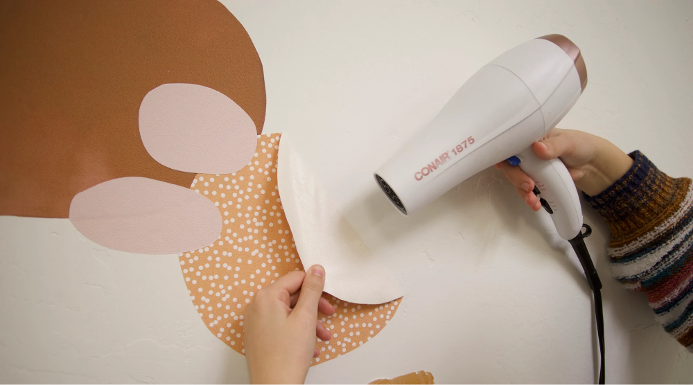 heating wall decal with hair dryer for removal