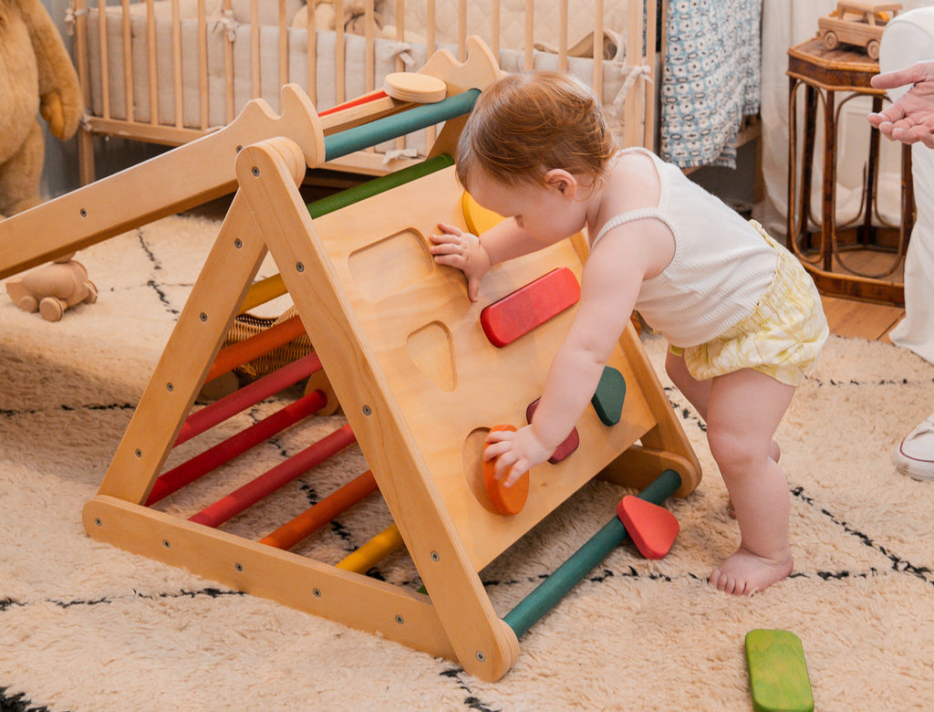 Toddler Playing with Small Pikler and Shape Sorter