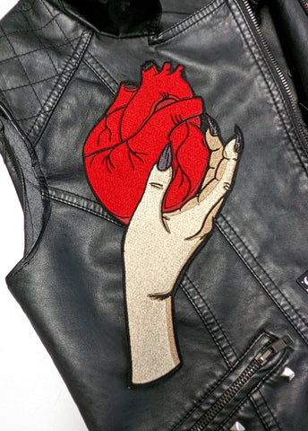 Vampire hand holding an anatomical heart stitched into a iron on patch