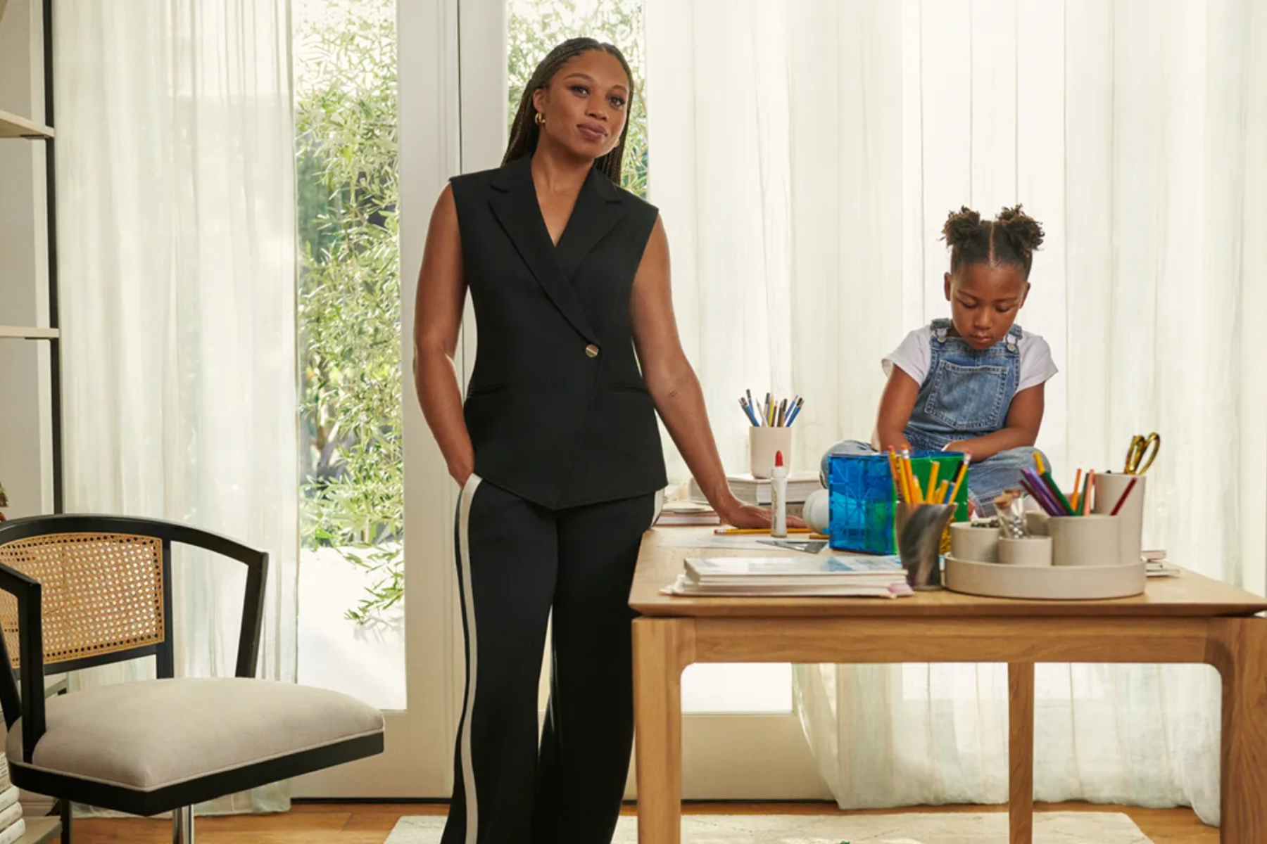 Image shows woman wearing Spanx apparel alongside her child. Spanx by Sara Blakely revolutionized the shapewear industry with its innovative products, proving the power of a good idea and sheer determination.