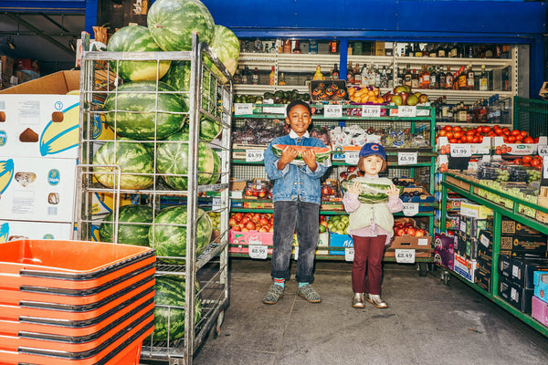 kids wearing sustainable zig+star shoes outside a grocery store