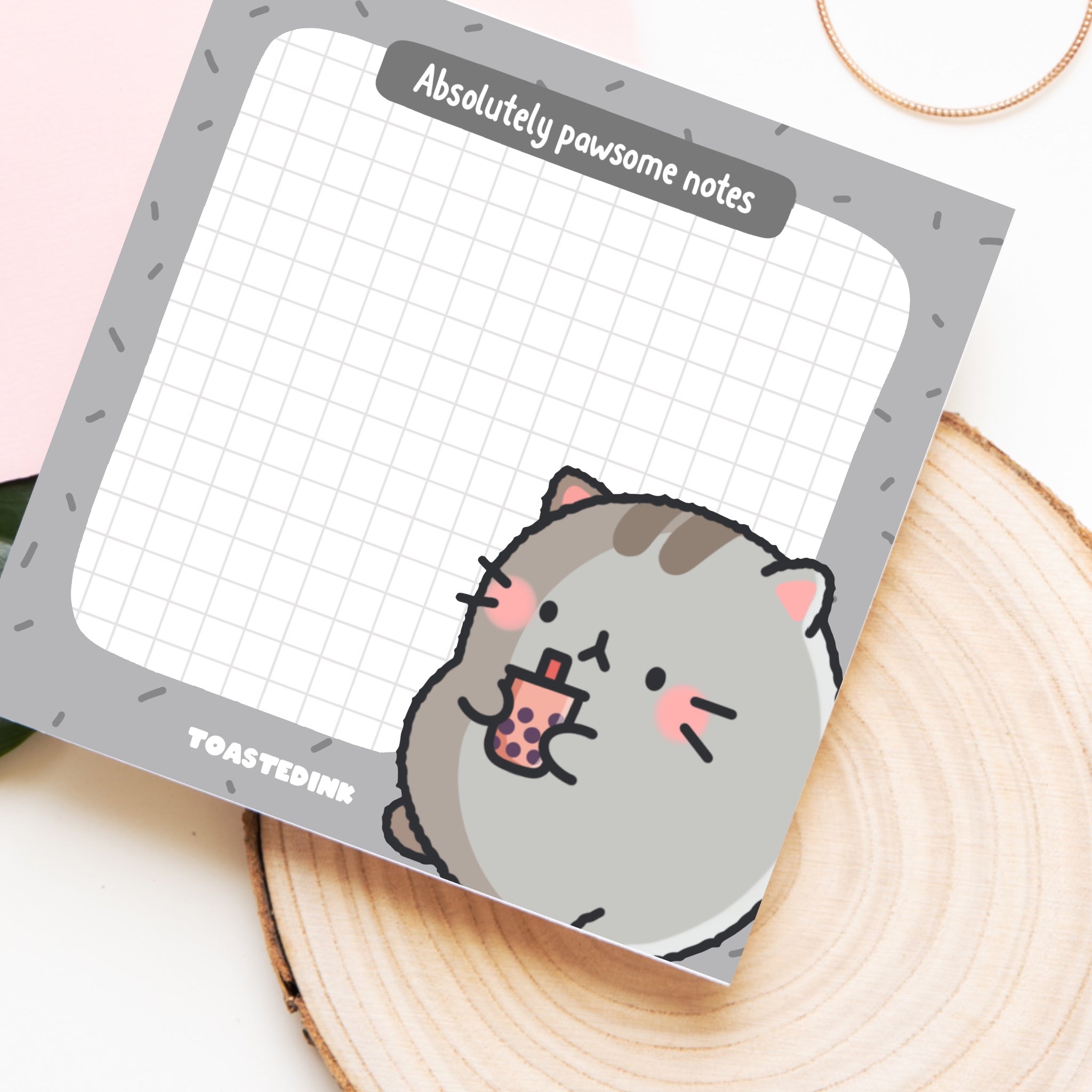 Cat sticky notes on wooden block