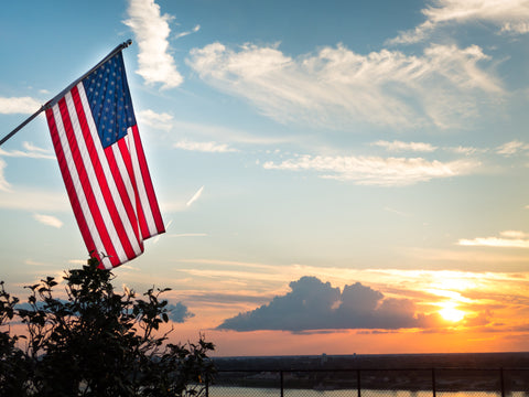 American flag as the sun is setting