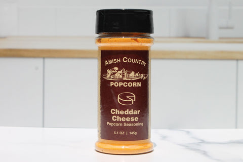 Cheddar-rich popcorn seasoning for a mouthwatering treat, crafted in the USA for the ultimate cheese experience.