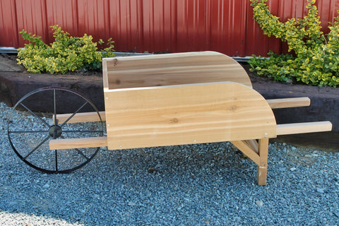 Authentic Amish-crafted old wheelbarrow planter, perfect for showcasing plants. Durable, USA-made wooden design.