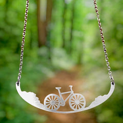 Handcrafted in the USA, this stainless steel chain necklace with bicycle pendant is fashionably versatile & nickel-free.