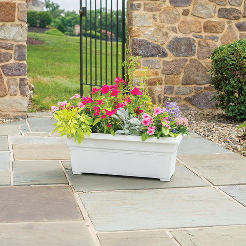 White flower box planters are 26.5" L x 10" H x 11" W from Harvest Array