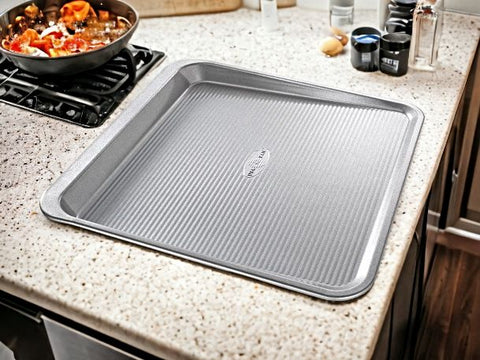 Enjoy perfect bakes with our 14x14 inch nonstick cookie tray, crafted in the USA for quality and convenience.