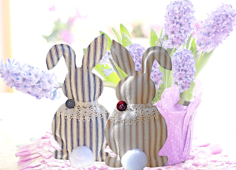 Handcrafted Easter or Spring Easter Bunny decorations have a big fluffy cotton tail and a lace shawl with a button accent.