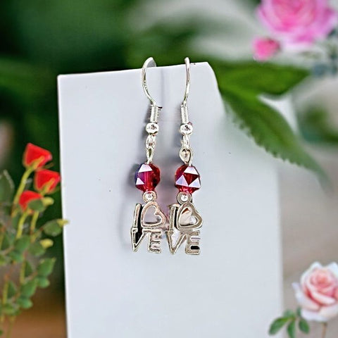 Explore our unique hoop earrings with dazzling red crystal accents. Handcrafted unique earrings, made in the USA for a truly special gift.