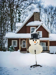 Uplift your Christmas yard decoration with a Snowman Yard Stake, a metal snowman made in America, perfect for festive outdoor decor.