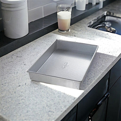 Perfect your baking with our 13 x 9 cake pan. Durable, rectangular, made in the USA. Ideal for all your cake creations!