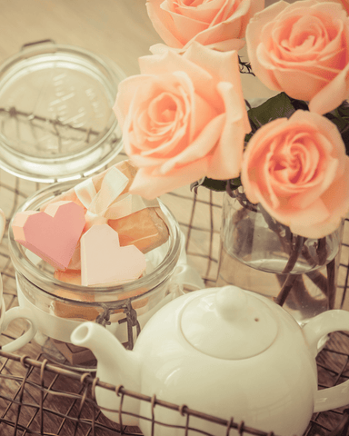 white rose with white teapot