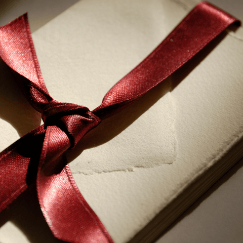 letter got wrapped around with a red ribbon