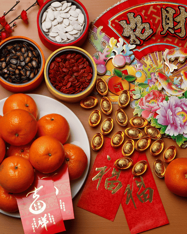 essential chinese  new year items such as oranges, red decoration and red envelope