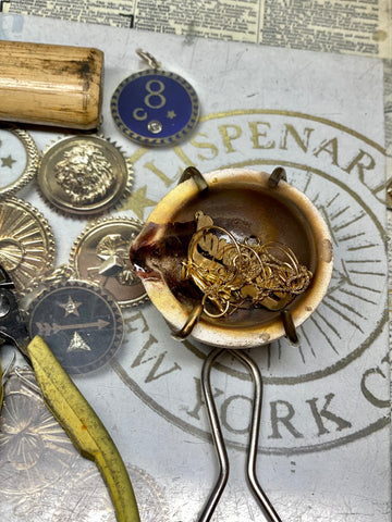 Gold jewelry in a little pot