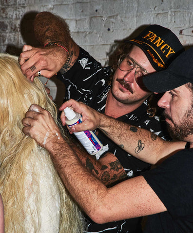 Team working on hairstyle at Elena Velez SS2024 show at NYFW with hair by Isaac Davidson forSALWA PETERSEN®