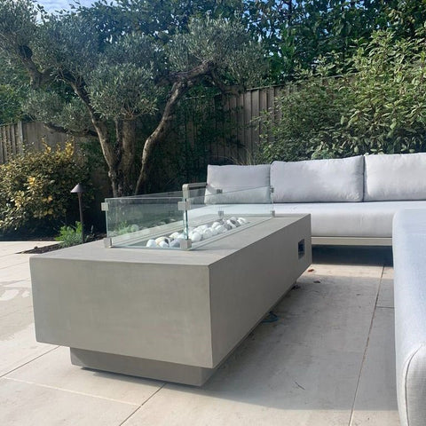 Concrete gas fire pit with garden sofas