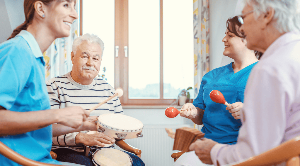 Art Therapy for Psoriasis - a group of people making music with rhythm instruments as musical therapy.