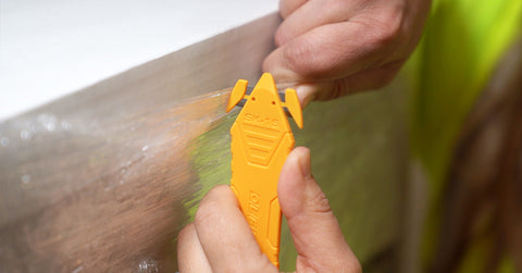 Safety professional cutting shrink wrap with OLFA SK-15 Knife