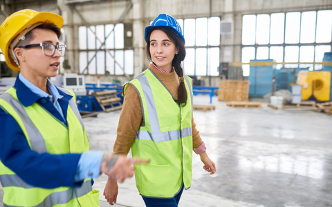 Forewoman showing construction site to new employee with OLFA Safety Tips to Avoid Slip Accidents