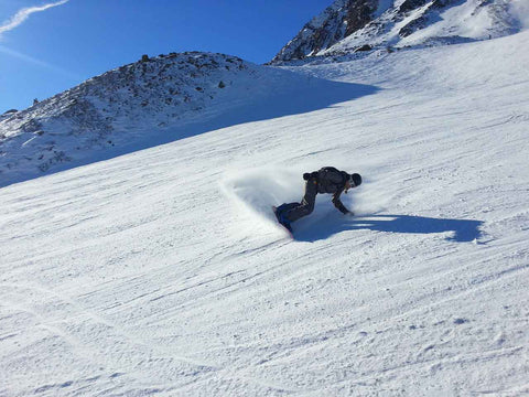 Person riding an all-mountain snowboard