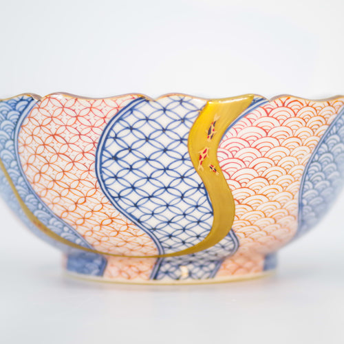 Beautiful Kintsugi bowl adorned with a hand-painted koi fish. Shop authentic Japanese ceramics with gold repairs. 