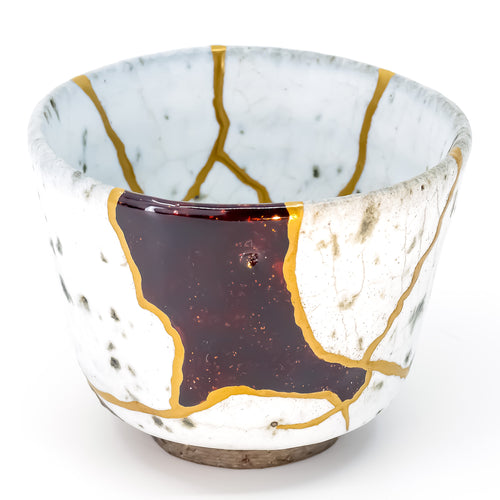 Full-color image of an authentic Kintsugi pottery piece, showing its intricate repairs and unique design Handcrafted Kintsugi pottery, embracing imperfection with golden beauty. Celebrate Wabi-sabi aesthetics with this unique Japanese ceramic.