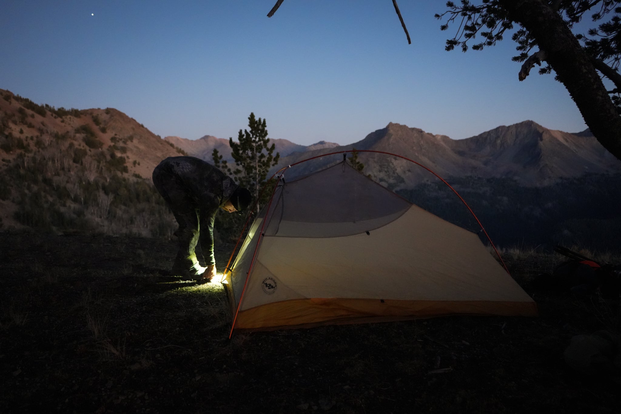 setting up tent in the backcountry