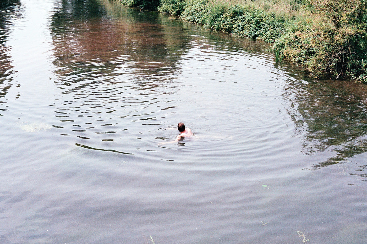 man swimming in river