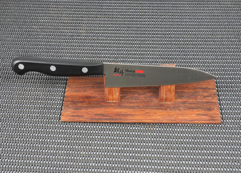 Murato Sharp Series 125mm Petty (Utility) Japanese Kitchen Knife with black resin handle on a red wood stand