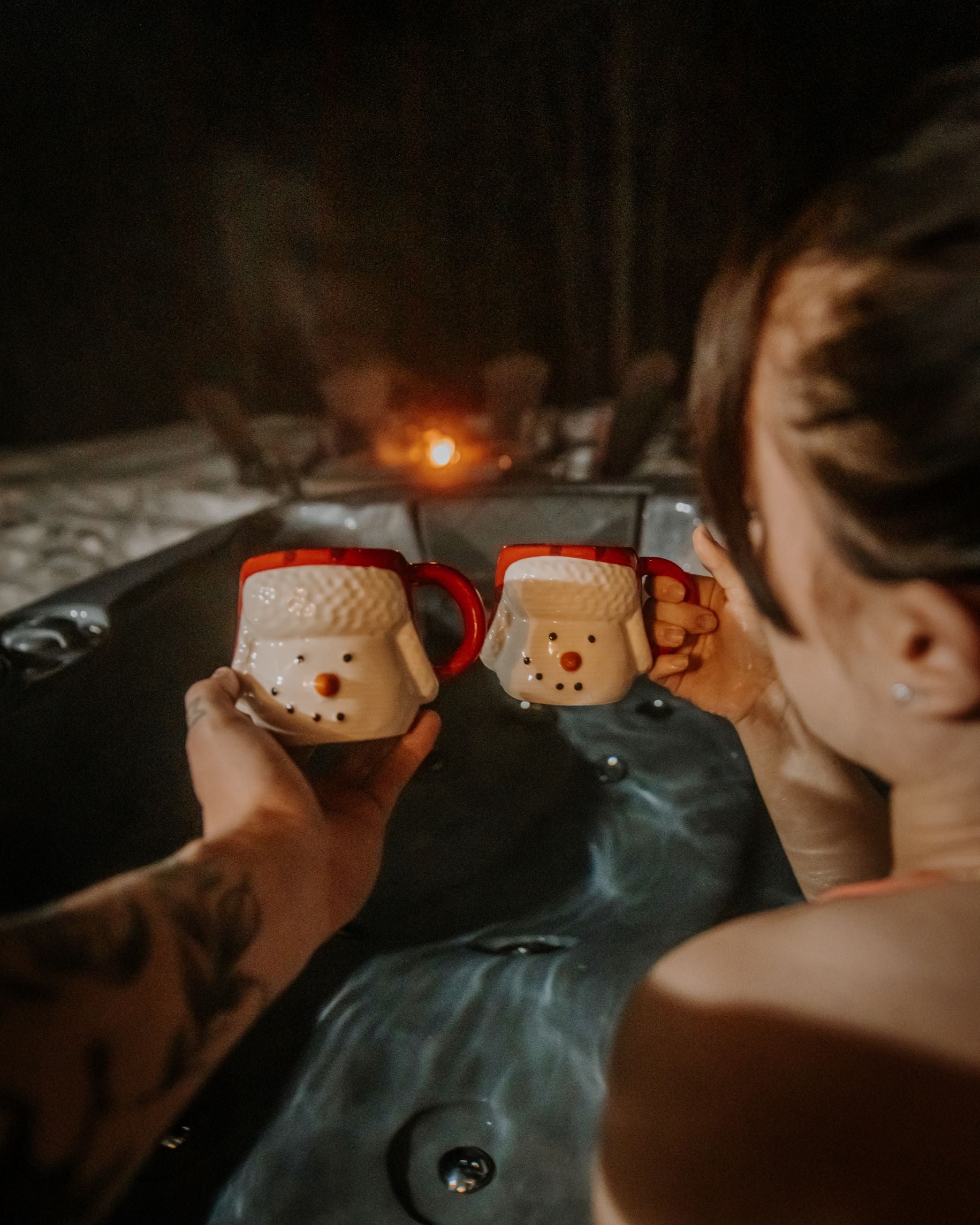 Woman in hot tub with mug