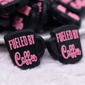 https://cdn.shopify.com/s/files/1/0510/3717/5993/products/Fueled-By-Coffee-pink-on-black-silicone-focal-bead-close-up_280x.jpg?v=1680558017