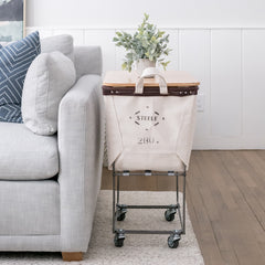 Elevated canvas laundry hamper on wheels