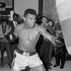 heavyweight world champion Ali with ampro punch bag