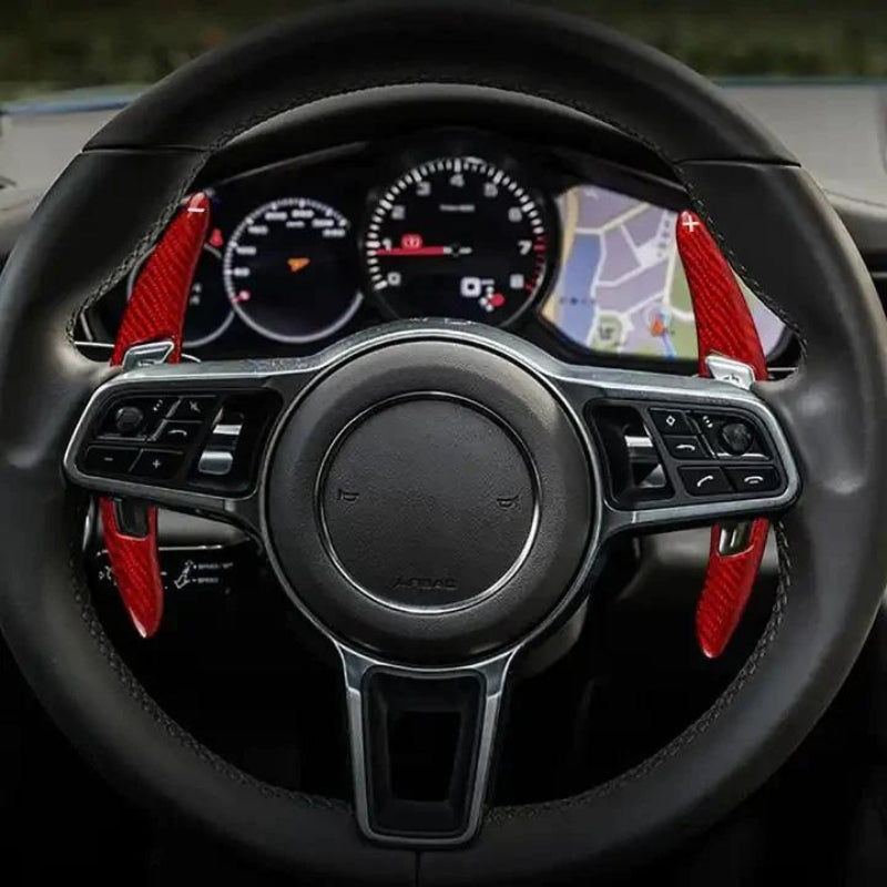 Enhance your Porsche model (2018-2022) steering wheel with our shift paddle extensions.