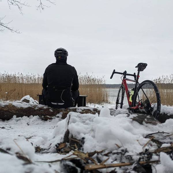 Cyclist sitting in the snow