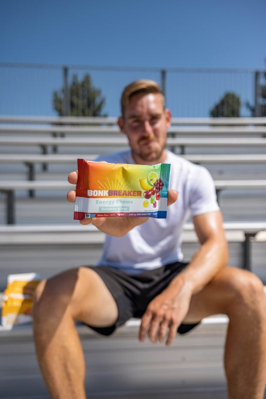 Bonk Breaker athlete ambassador holding a packet of Energy Chews