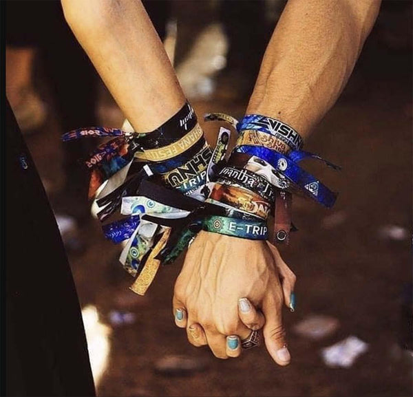 Friends with festival wristbands