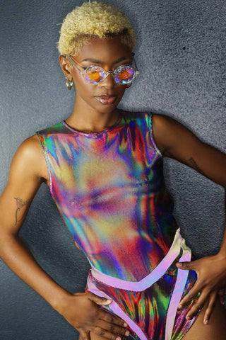 a woman wearing a rainbow holographic bodysuit