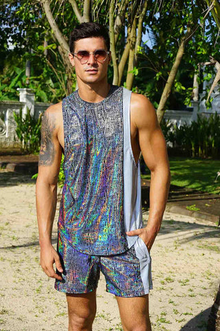 A man wearing a holographic outfit set to EDC