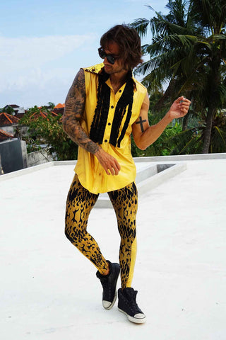 man wearing a black and gold outfit at a roof party