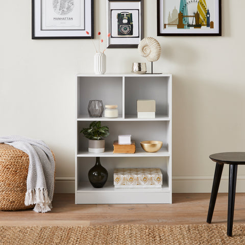 White bookcase storage frame with two cube shelves and two large rectangular shelves