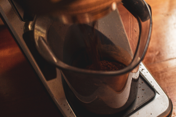 Grinding coffee beans using electric Baratza burr coffee grinder