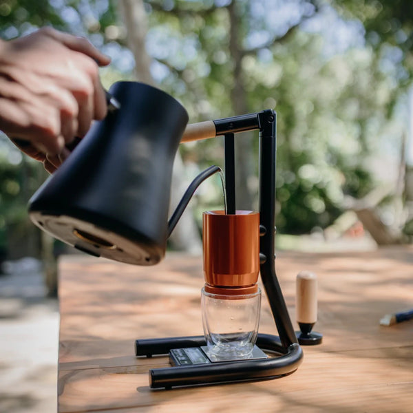 Pouring hot water into the newton BRUA espresso maker