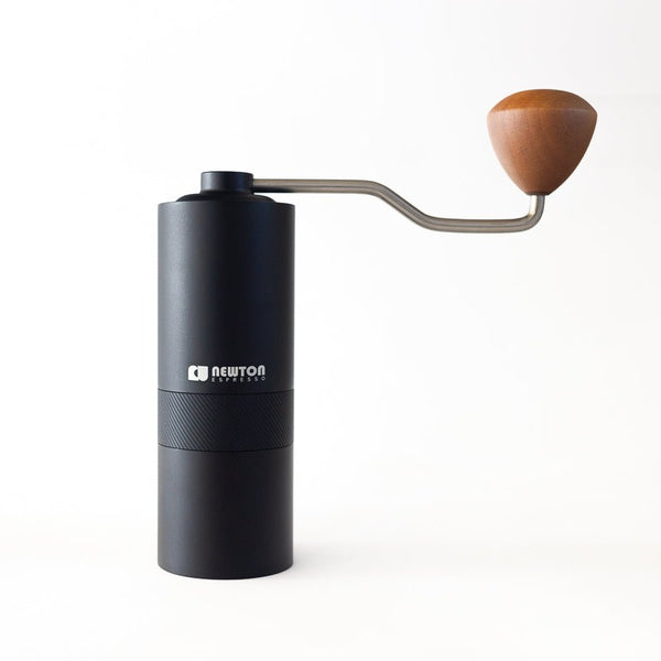 Manual coffee grinder on white back drop