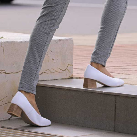 white court shoe on step