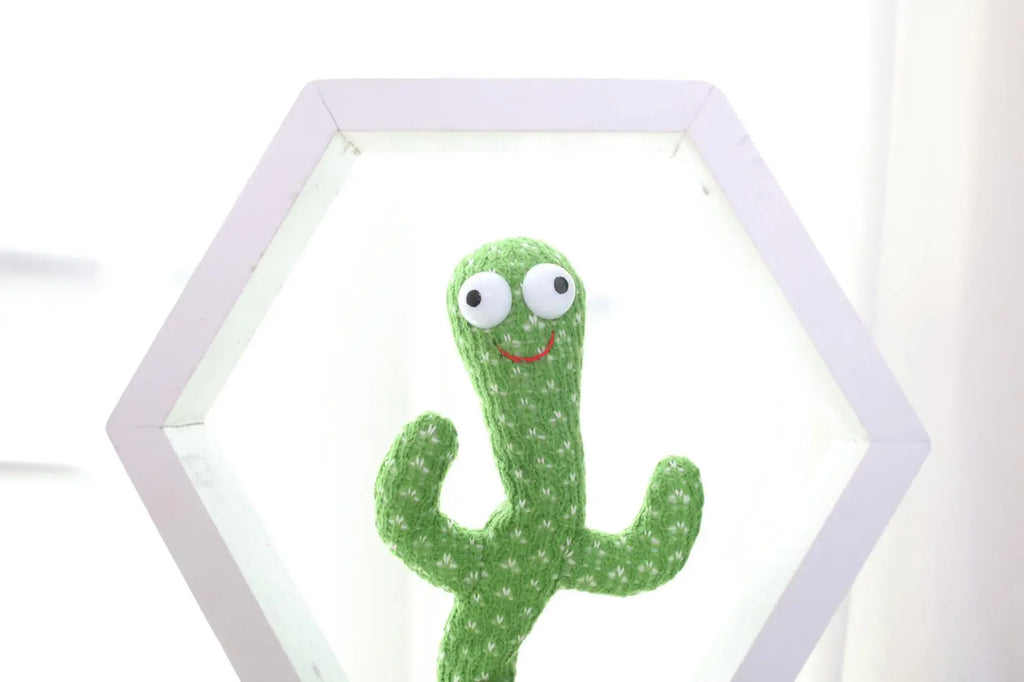 white background, green fabric, voice-activated talking-singing and dancing cactus toy, white rectangle