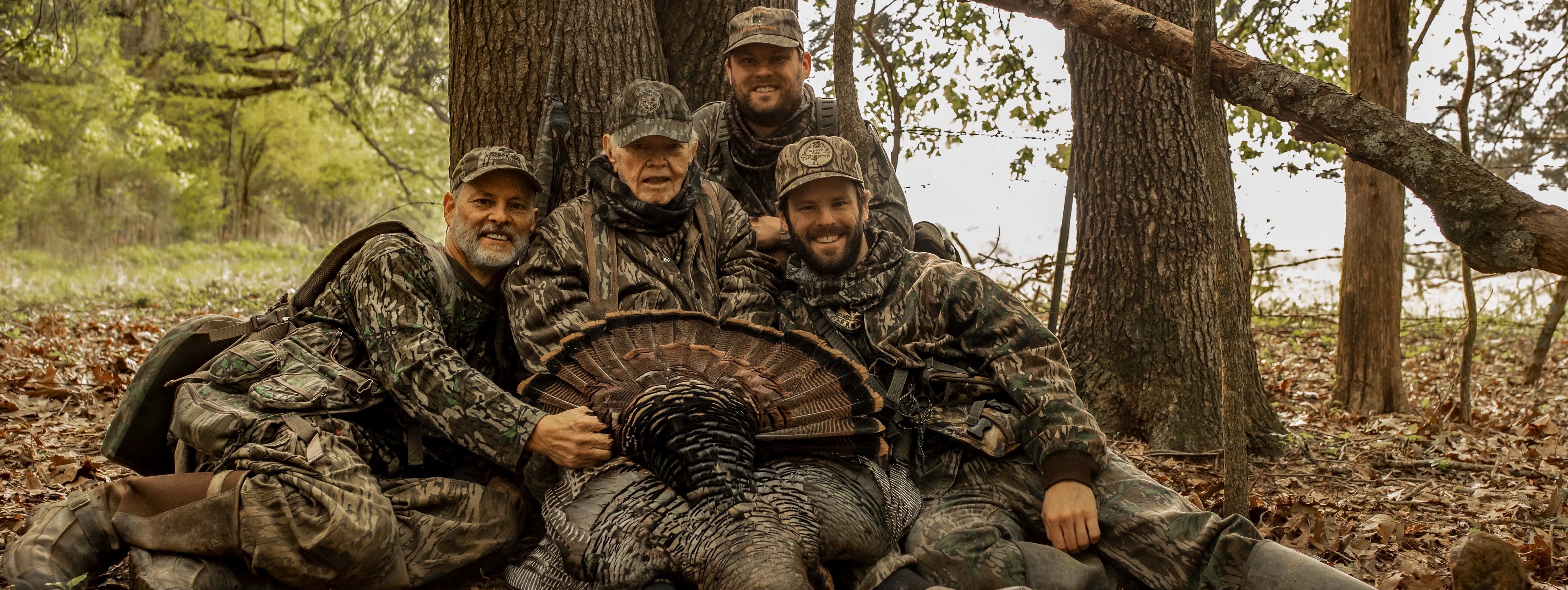 Mr. Fox with his 2022 turkey posing with Toxey, Daniel, and Neil